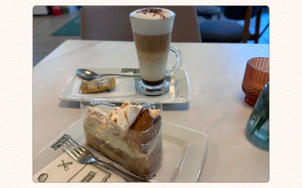 Coffee and cake served at a quiet Budapest café table